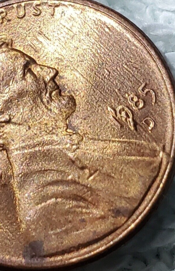 1985 Lincoln Cent date Error letters in background  - Image 1 of 4