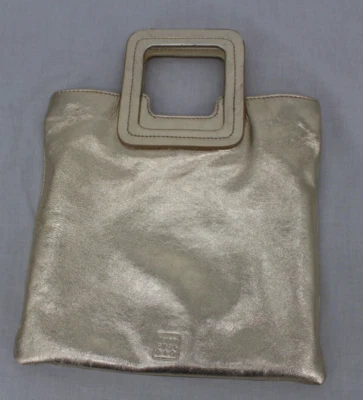 Bandolera plegable TMRW Studio Clutch Mateo tono dorado Foto 1 de 4