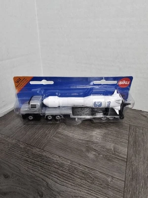 Siku 17cm Long Diecast 1614 - Scania Low Loader With Rocket - Silver/White - Image 1 of 4