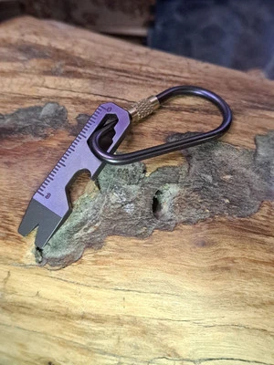 Mini abrebotellas llavero de titanio EDC Foto 1 de 4