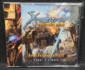 X-Morph Defense Original Offizielles Videospiel Soundtrack CD mit Obi Strip - Bild 1 von 7