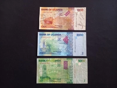 UGANDA 1000 + 2000 + 5000 SHILLINGS Banknotes - Circulated / Damaged - Image 1 of 2