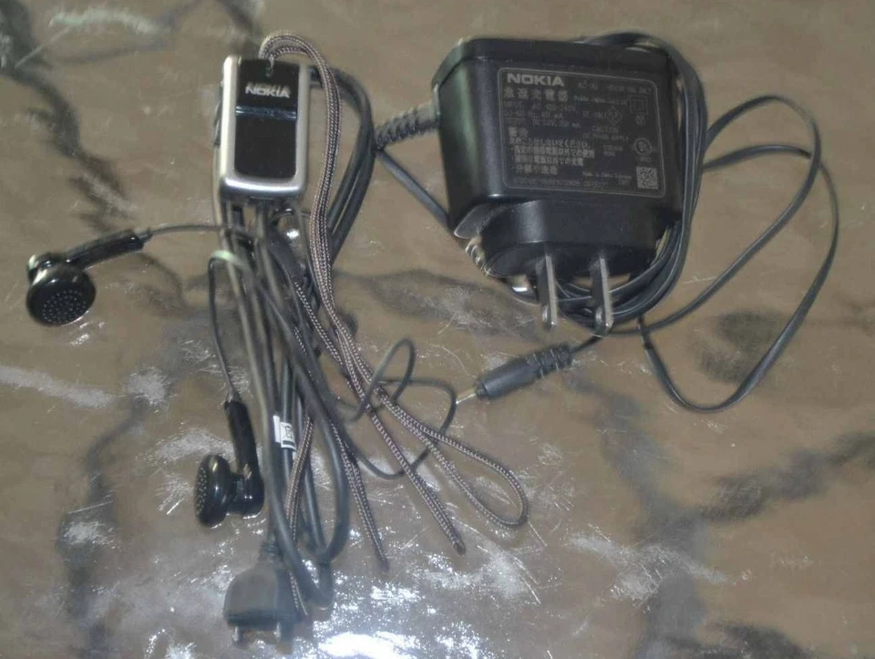 NOKIA CELLPHONE ACCESSORIES CHARGER AND HEADSET - Image 1 of 1