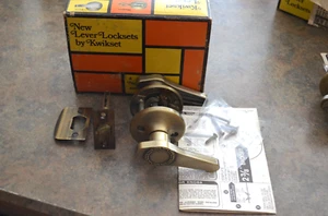 KWIKSET DOOR LEVER GRECIAN ANTIQUE BRASS US5 PASSAGE LATCH 200GL - Picture 1 of 5