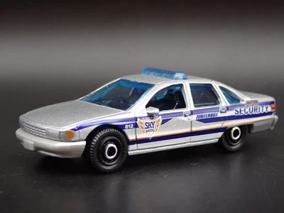 1991-1996 CHEVY CHEVROLET CAPRICE POLICE SECURITY 1/64 SCALE DIECAST MODEL CAR - Image 1 of 4