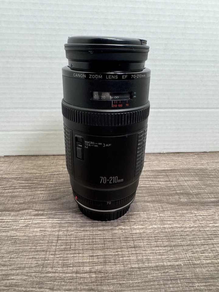 Lente zoom Canon EF 70-210 mm 1:4 con tapas de lente y teleconvertidor TC - DC58N 1,75x Foto 1 de 4