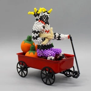 NATIVE AMERICAN BEADWORK-KOSHARE  SITTING IN RED WAGON  by JODY BOOQUA-ZUNI - Picture 1 of 7