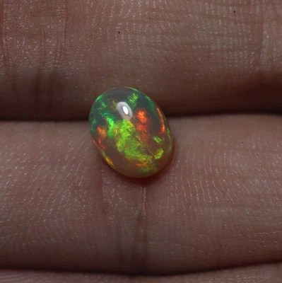 8X10 MM 1.4 Cts Real AAA Green Red Yellow Blue Fire Ethiopian Opal Oval Cabochon - Image 1 of 4