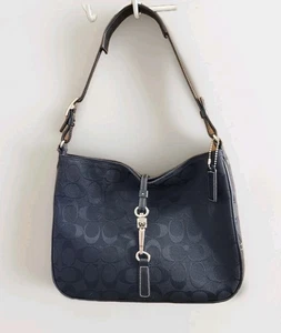 Bolso de mano Coach 6091 Signature con clip en C negro de lona con adornos de cuero  - Imagen 1 de 13