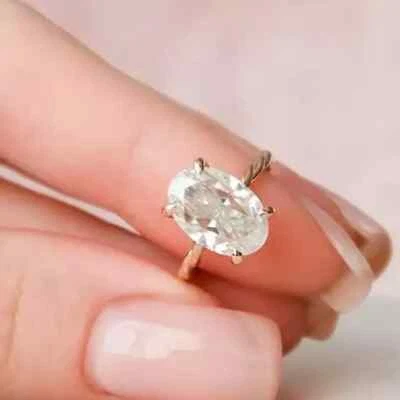 Anillo de compromiso de banda retorcida de moissanita de corte ovalado de 2,16 quilates enchapado en oro rosa de 14 quilates Foto 1 de 4