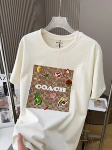 NUEVO CON ETIQUETAS COACH Mujer’s Signature Camiseta Beige ALGODÓN - Imagen 1 de 8
