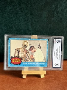 STAR WARS 1977 TOPPS #27 REPAIRS FOR C-3PO BLUE UK ISSUE GRADED MGC 8 VINTAGE - Picture 1 of 2