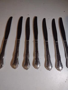 Vintage Oneida floral pattern set of 7 Stainless Flatware Butter Knives - Picture 1 of 4