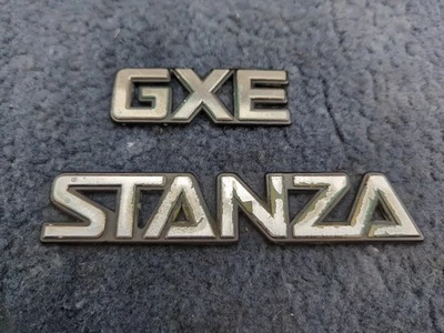 1987 Nissan Stanza GXE Rear Emblem Badge Decal Trunk OEM - Image 1 of 4