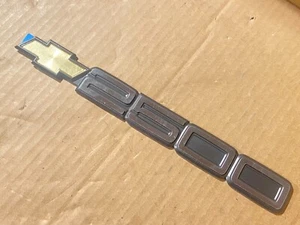 GM 15551234 Adhesive Door Emblem - 88-99 Silverado 2500 w/o Body Side Trim - NOS - Picture 1 of 4