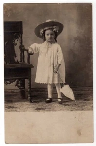 CUTE GIRL WEARING HAT CHILD SIZE UMBRELLA PHOTO RPPC POSTCARD CIRCA 1910 - Picture 1 of 2