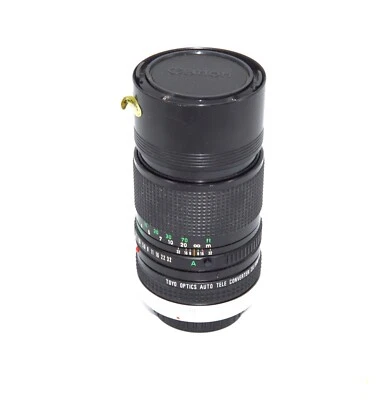 Canon FD 135 f3.5mm Lens with Front and Back Caps and Toyo 2x Teleconverter - Image 1 of 4