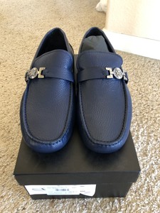 white and gold versace loafers