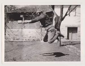 The Man in Mid-Air Gravity-Defying Moment Frozen in Time Unusual Abstract Photo - Picture 1 of 7
