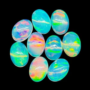 Lotto 9 pezzi pietre preziose cabochon sfuse opale naturale etiope 7x5 mm ovale non trattato - Foto 1 di 10