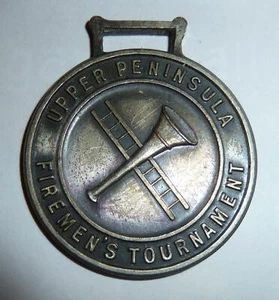 Metal Watch Fob UPPER PENINSULA Michigan FIREMAN'S TOURNAMENT Horn & Ladder  - Picture 1 of 2
