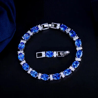 Hermoso brazalete de boda de circonita cúbica de corte ovalado azul grande plateado para mujer Foto 1 de 4