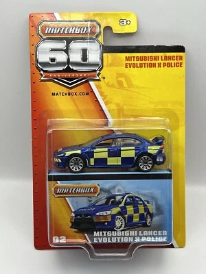 Matchbox ’10 Mitsubishi Lancer Evolution X "POLICE" 60th anniversary  1/64 OVP - Bild 1 von 3