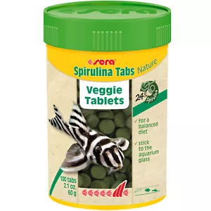 Sera Spirulina Tabs Nature 100 ml se adhiere al vidrio del acuario que puedes ver comer peces - Imagen 1 de 2