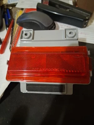 NOS1990-1991  Olds H BODY /DELTA 88  L/R  Bumper Reflector Lens Red 5975636 - Image 1 of 3