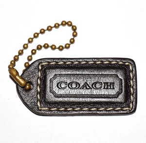 Llavero de etiqueta de cuero marrón chocolate oscuro COACH - Imagen 1 de 4