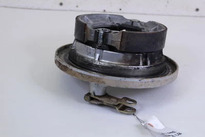 1987 KAWASAKI  KLF 300  BAYOU Left Rear Brake Plate Panel - Image 1 of 4