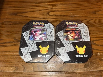 Pokemon 25th Anniversary Celebrations Tin Set: Lance's Charizard & Dark Sylveon - Image 1 of 2