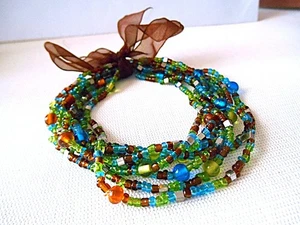 Pulseras elásticas con cuentas multicolores verde/marrón de 8 hilos - Imagen 1 de 4