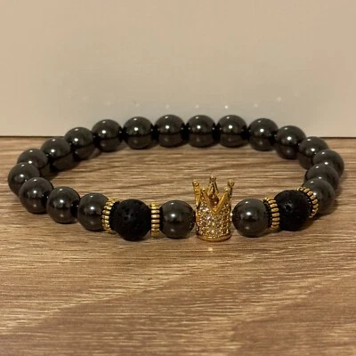 Brazalete negro elástico con puño dorado Crown King de lujo para hombre Foto 1 de 4