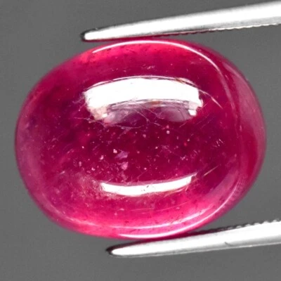 13.37ct 14x11mm Oval Cabochon Purplish Red Ruby Gemstone (Heated Glass Filling) - Image 1 of 4