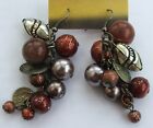 Brown shades & silver tone ball, silver tone egg beads and "coins", drop pierced