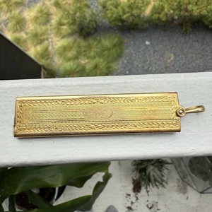 Antiguo cepillo de bolsillo plegable vintage FM Co chapado en oro mini peine - Imagen 1 de 8