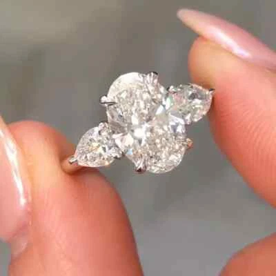 3.85 TCW Oval Cut Moissanite Three Stone Engagement Ring 14K White Gold Plated - Image 1 of 4
