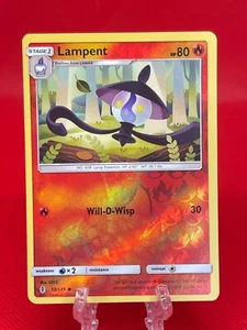 Pokemon Juego de Cartas Coleccionables Lampent 12/145 Sun & Moon Guardians Rising Reverse Holo 2017 Casi Nuevo - Imagen 1 de 2