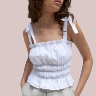 Top de lino con tirantes fruncidos Reformation para mujer talla M blanco con volantes dobladillo coqueta Foto 1 de 4