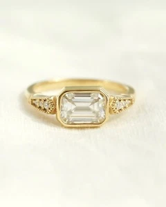 East To West Bezel Set Sterling Silver Moissanite Emerald Cut Engagement Ring - Picture 1 of 5
