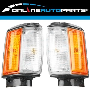LH+RH Corner Indicator Park Lights Pair w/Black Trim for Toyota Hilux 2WD 83-88 - Picture 1 of 8