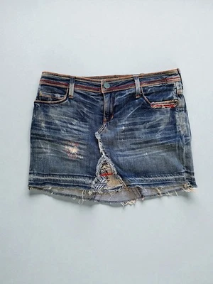Minifalda vaquera 575 desgastada retazos Y2K dobladillo crudo azul para mujer talla 28” Foto 1 de 4