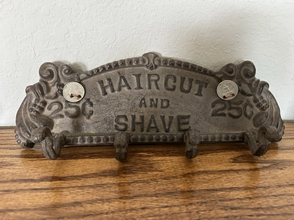 Letrero publicitario vintage de hierro fundido estilo rústico “corte de pelo y afeitado” 25c cortes-leer Foto 1 de 4