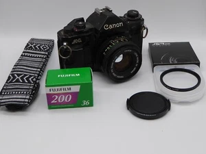 Cámara fotográfica Canon A1 35 mm SLR 50 mm f1,8 lente + filtro + tapa + sellos nuevos REPARADOS - Imagen 1 de 6