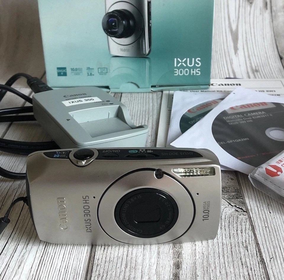 Canon IXUS 300 HS Camera + Battery/Charger, Leaflets, Discs, Cable, Wrist Strap - Image 1 of 4