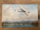 Vintage Tucks colour post card of biplane doing A banked right-hand turn