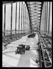 Two trucks on the Sydney Harbour Bridge during its construction, N- Old Photo