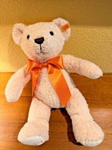 Steiff Teddybär Kuscheltier Jahr 2015 Stofftier mit orangenem Band - Bild 1 von 4