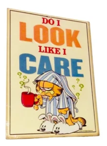 Letrero de metal en relieve Garfield Cat - Do I Look Like I Care 12 pulgadas H x 8 pulgadas. W - Imagen 1 de 1